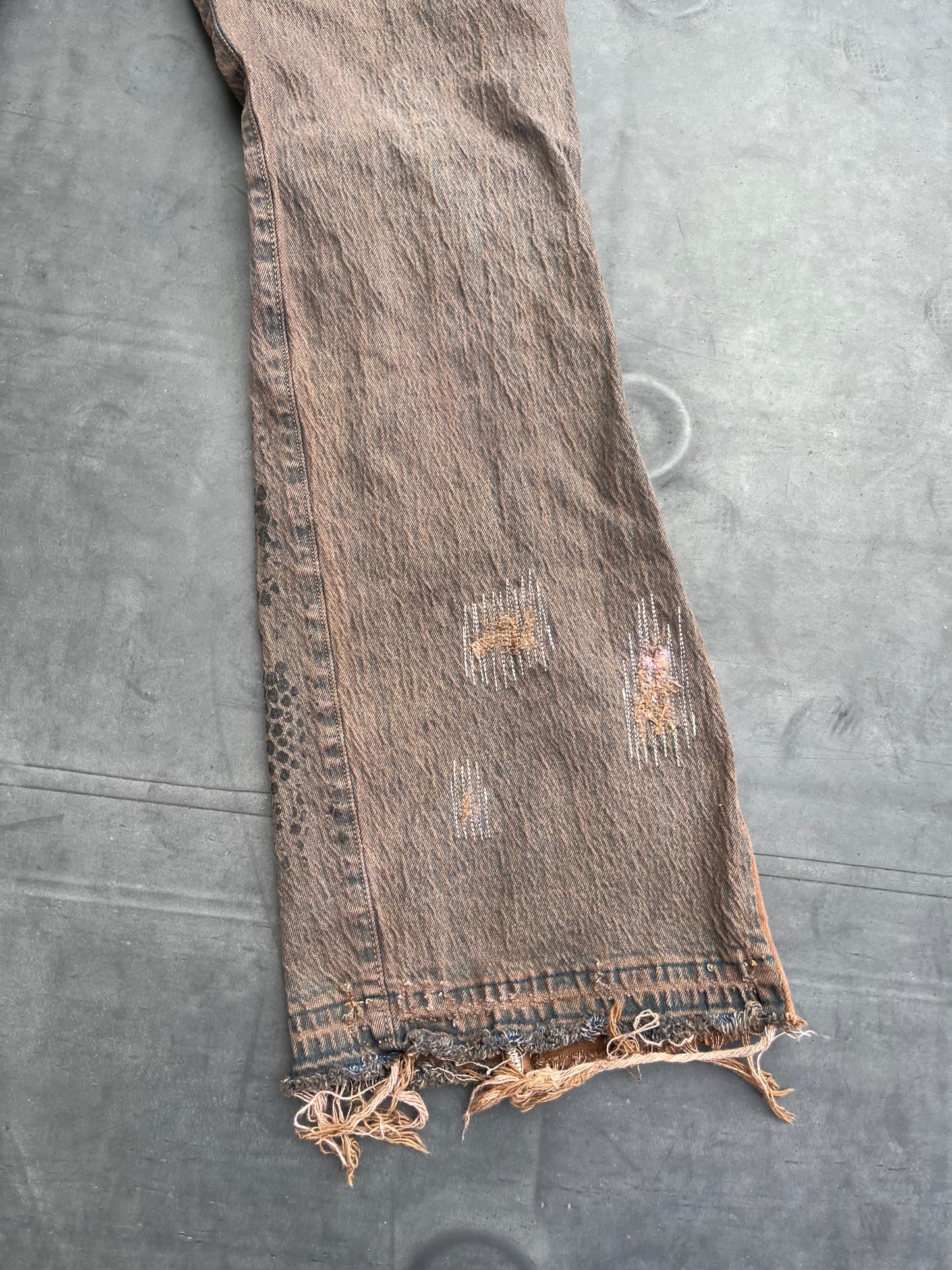 Dark brown reptilian denim